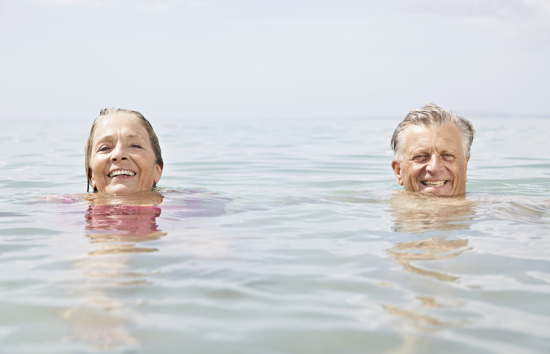 senior couple swimming