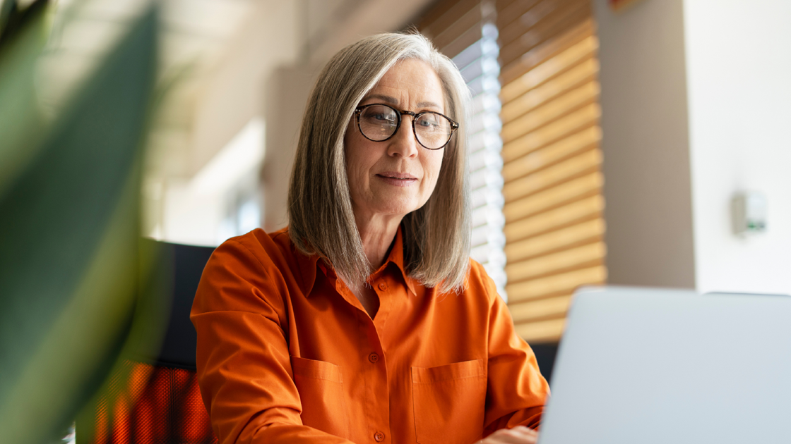 decorative image of a woman in front of a laptop