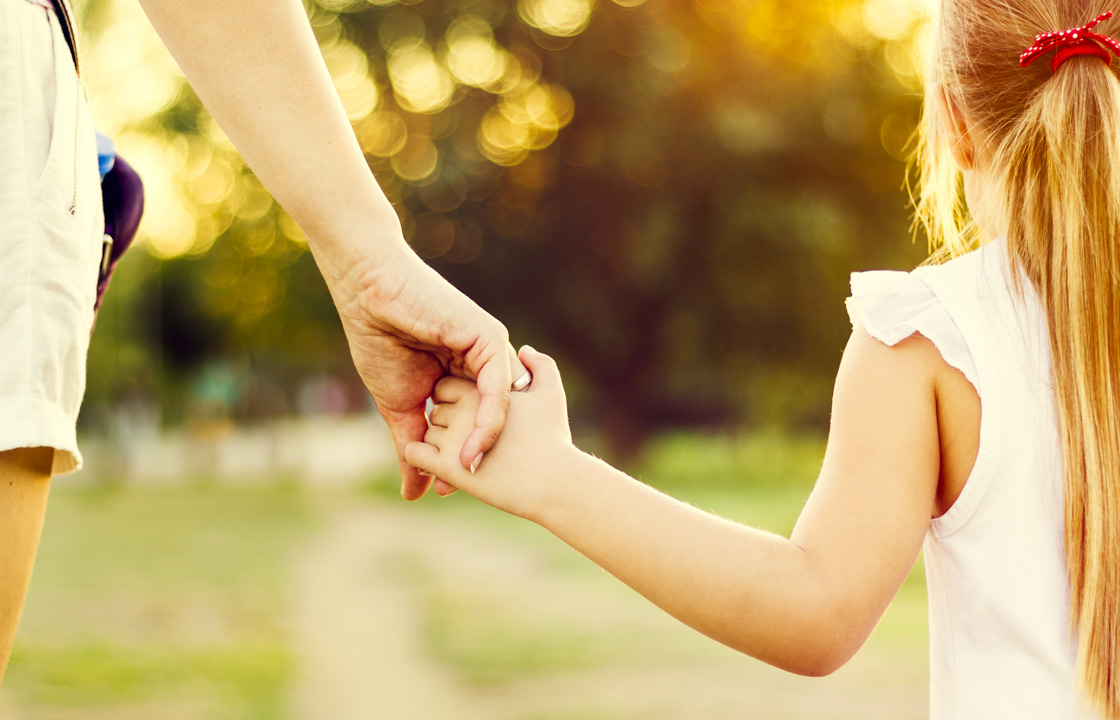 mother and daughter holding hands