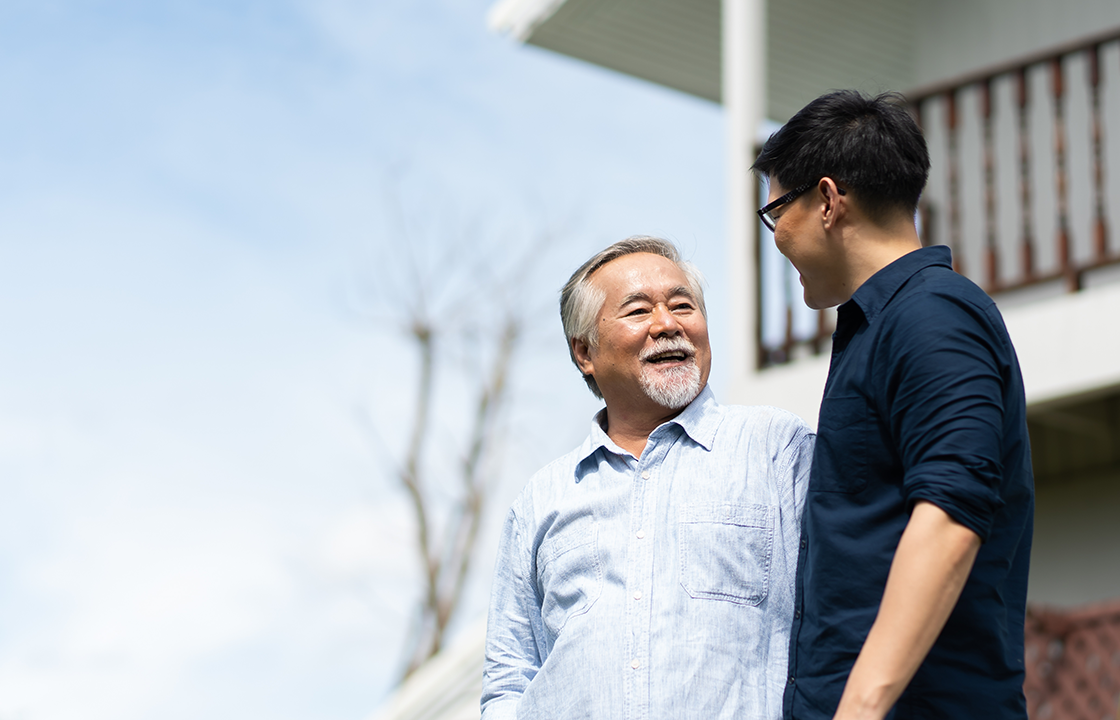 senior man with younger caretaker
