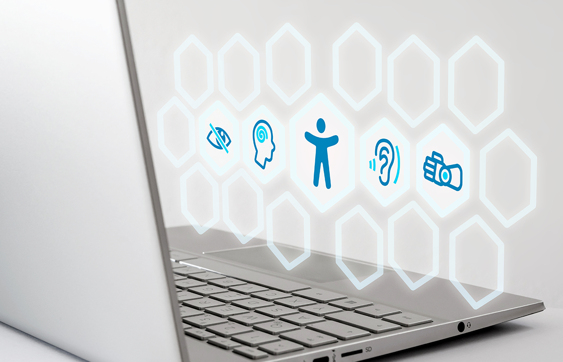 open laptop with accessibility icons floating over the keyboard